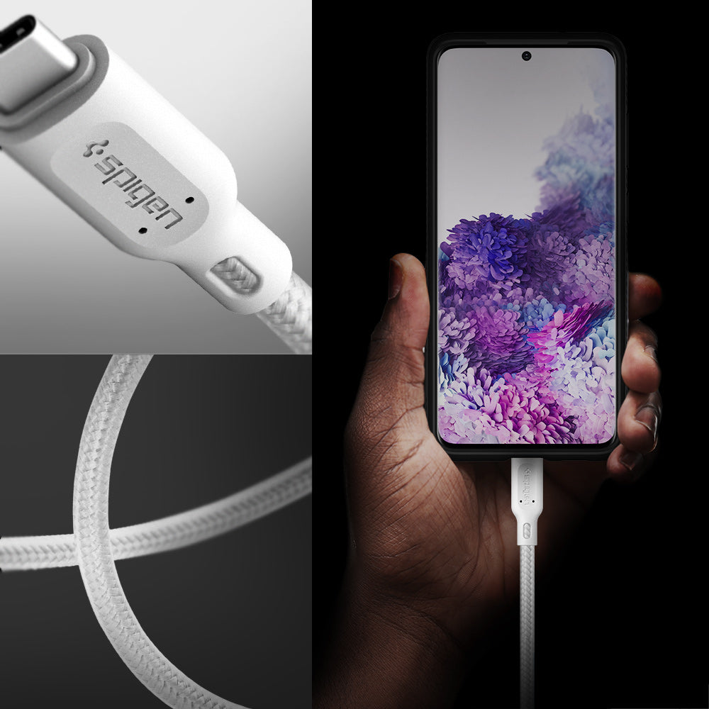 000CA25703 - DuraSync™ USB-C to USB-C 2.0 Cable C11C1 in White showing the a hand holder a device while attached to a charger, a head of a charger and it's durable wire