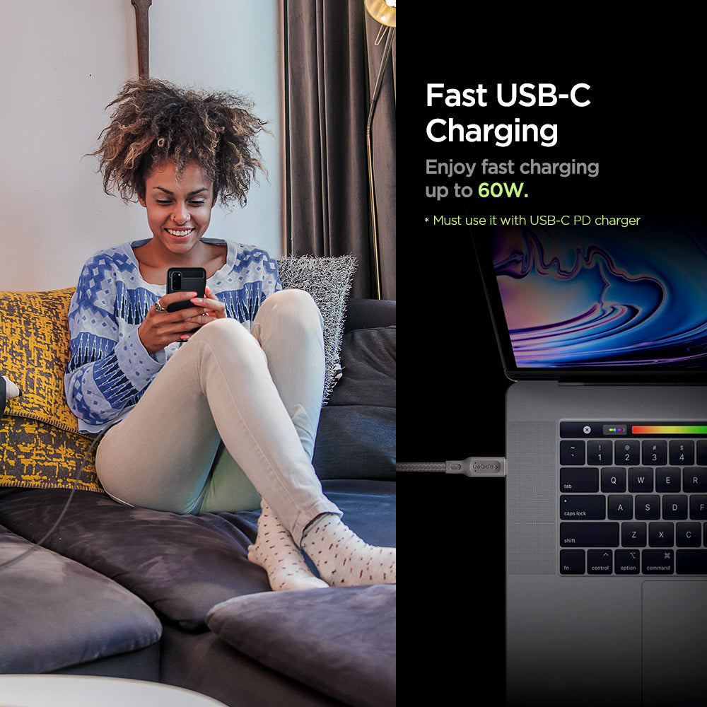 000CA25704 - DuraSync™ USB-C to USB-C 2.0 Cable C11C1 in Gunmetal showing the Fast USB-C Charging. Enjoy fast charging up to 60W. (Must use it with USB-C PD charger). A woman sitting while holding a device attached to a long wired charger and another device attached to a cable charger