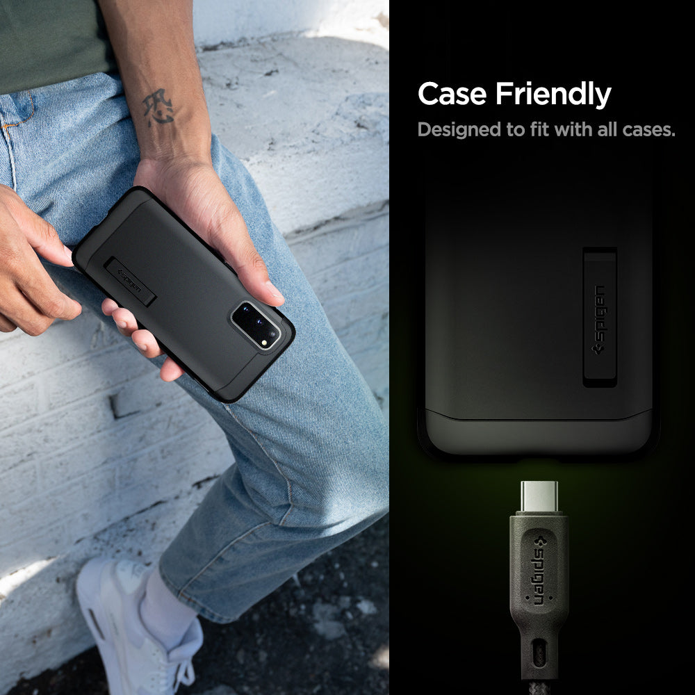 000CA25704 - DuraSync™ USB-C to USB-C 2.0 Cable C11C1 in Gunmetal showing the Case Friendly. Designed to fit with all cases. Showing half part of a device and a charging head pin hovering in front of a device charging port