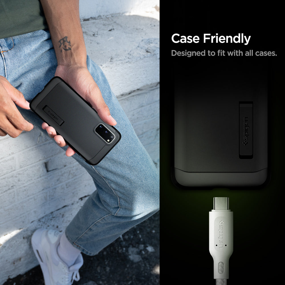 000CA25703 - DuraSync™ USB-C to USB-C 2.0 Cable C11C1 in White showing the Case Friendly. Designed to fit with all cases. Showing half part of a device and a charging head pin hovering in front of a device charging port