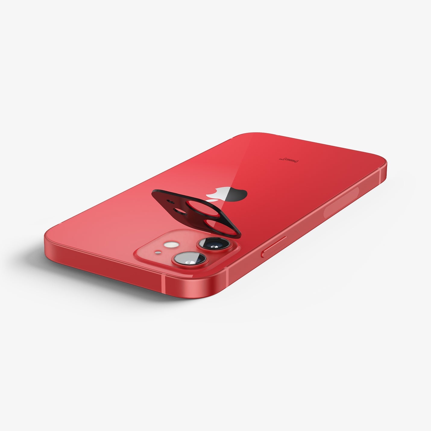 AGL02472 - iPhone 12 Optik Lens Protector in Product Red showing the lens protector partially hovering above the device on a flat surface