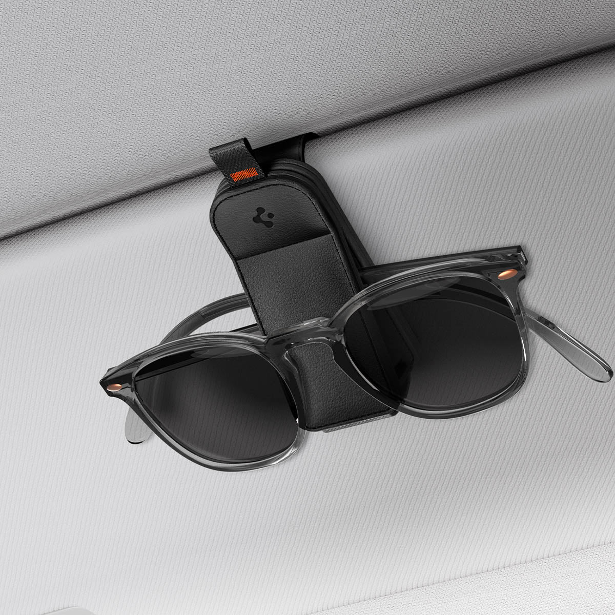 ACP08826 - Visor Leather Sunglass Holder SH101 in Black showing the holder attached to a car visor with sunglasses attached