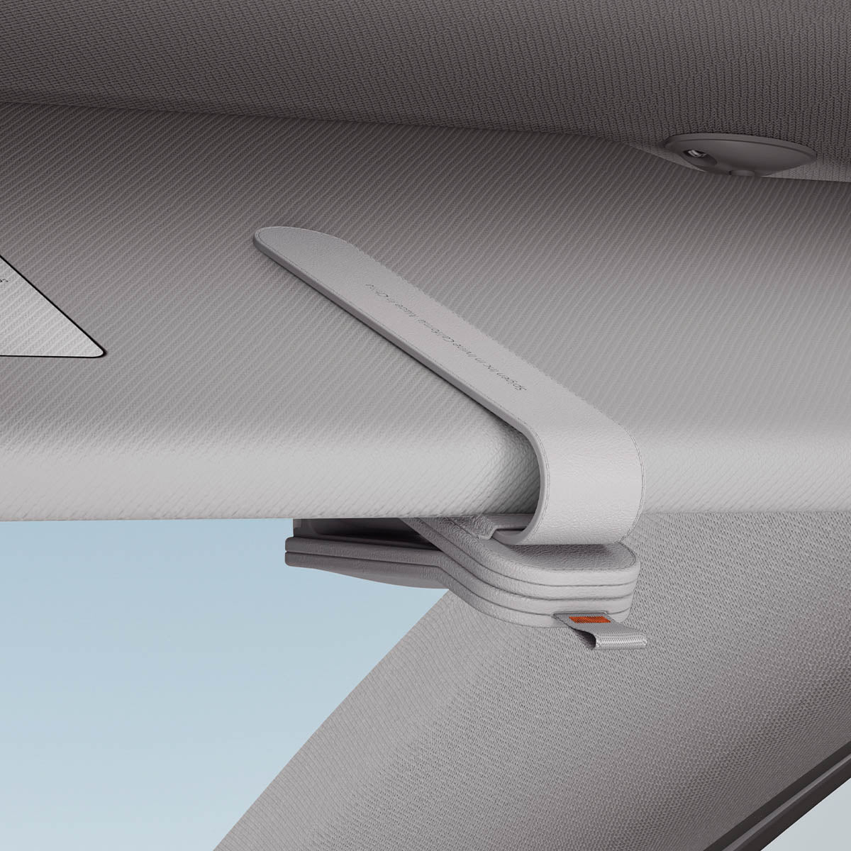 ACP08827 - Visor Leather Sunglass Holder SH101 in Gray showing the bottom clipped to a car visor