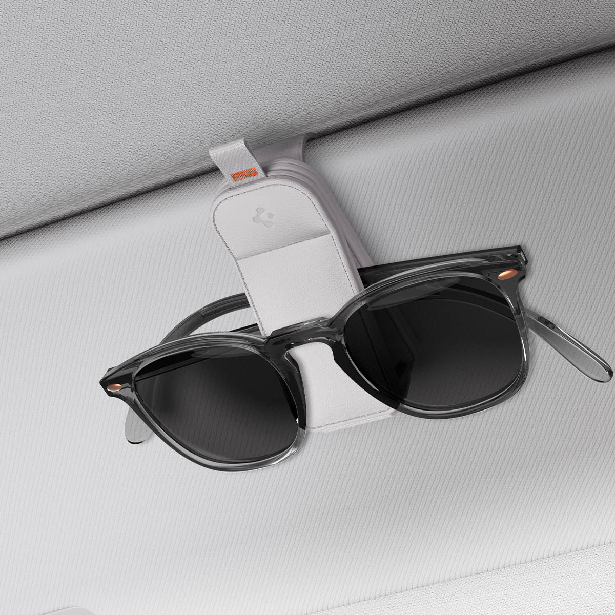 ACP08827 - Visor Leather Sunglass Holder SH101 in Gray showing the holder attached to a car visor with sunglasses attached