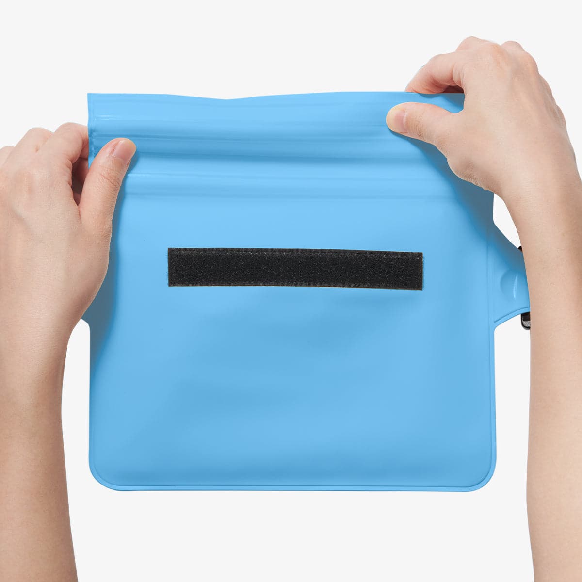 AMP06020 - AquaShield Waterproof Waist Bag (2 Pack) A620 in Sea Blue showing the first step in sealing the bag with its zip lock