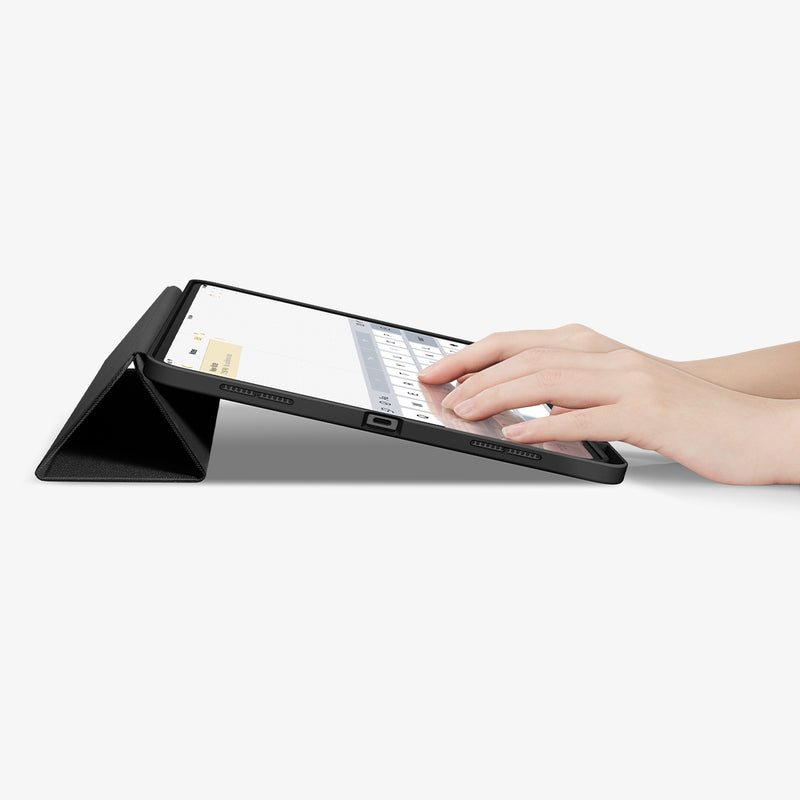 ACS07010 - iPad Pro 12.9-inch Case Urban Fit in Black showing the partial front with a hand typing on the device with a folded front cover propped up as a stand