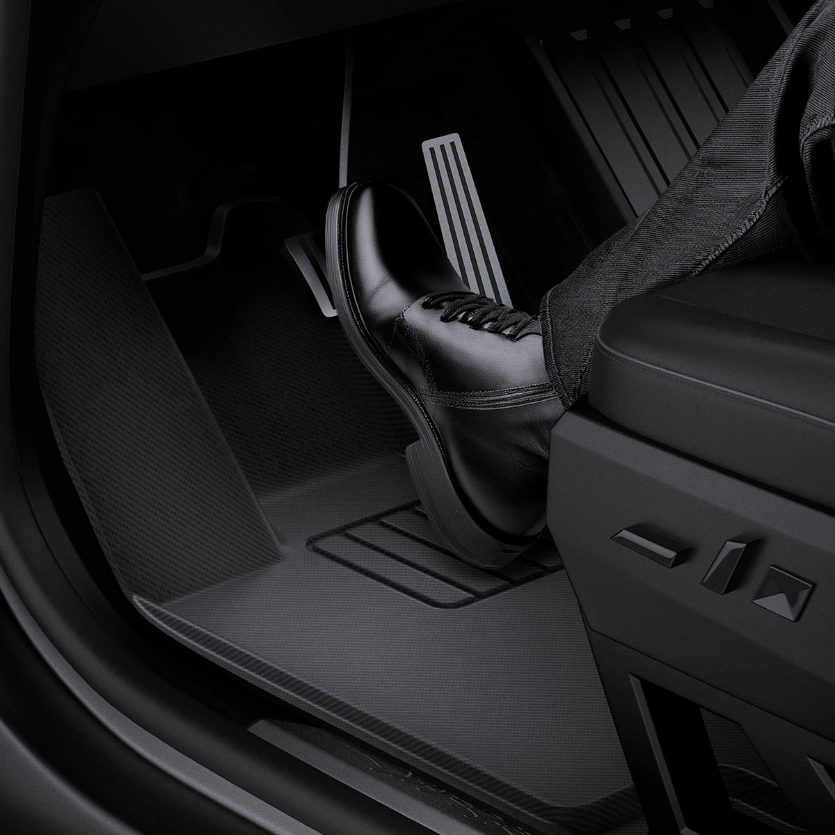 ACP08260 - Tesla Cybertruck WeatherBloc Floor Mat CLF in Black showing the floormat installed with a driver's foot hitting the pedal