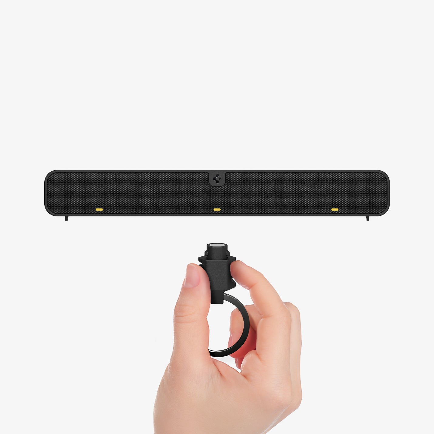 AHP06847 - Carabiner (Magnetic Keychain) Holder Hub in Black showing the front of the keyholder mounted on a wall while a persons hand holding part of the keychain holder attempting to attach to the magnetic keyholder hub