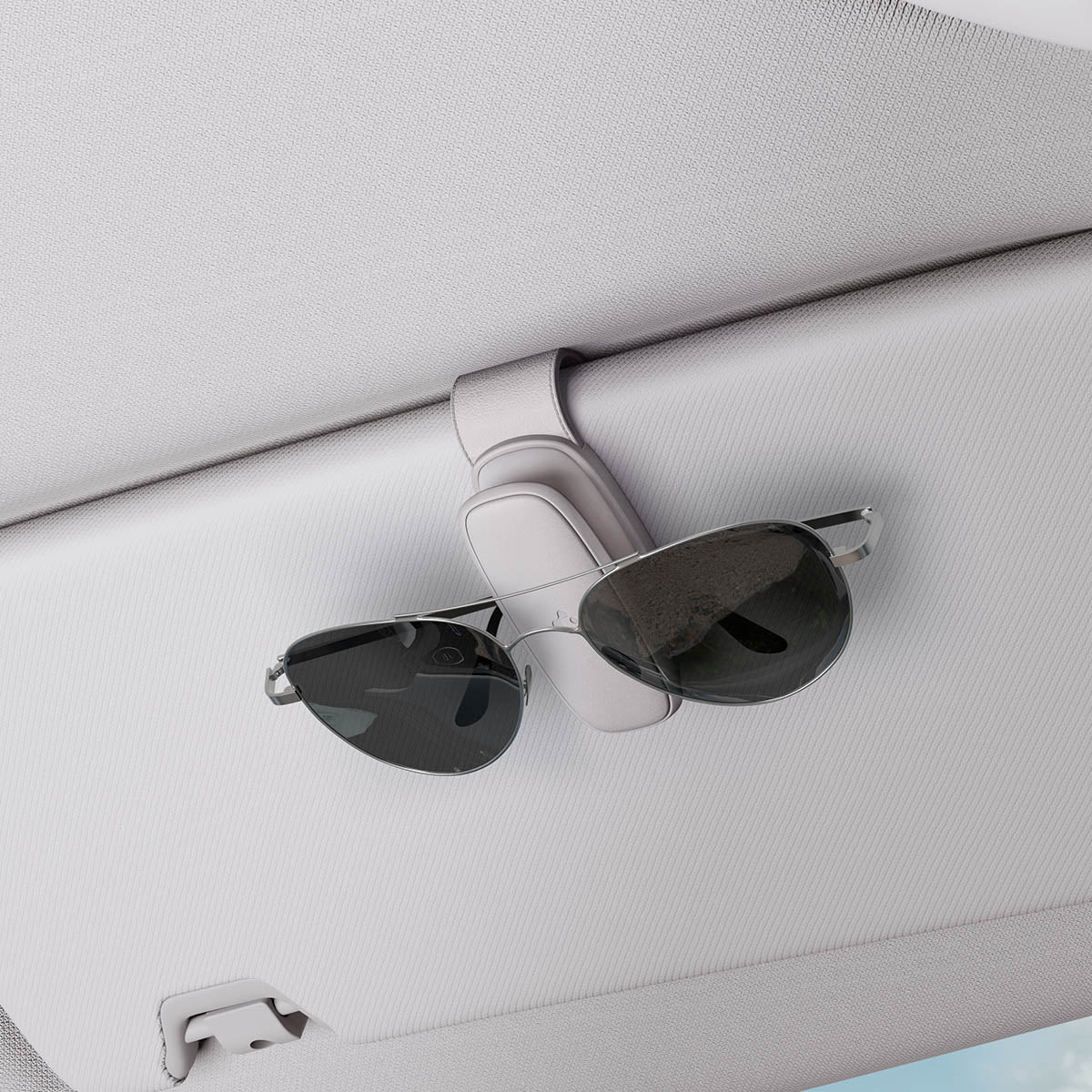 ACP08825 - Visor Sunglass Holder SH100 in Gray showing the holder attached to a car visor with sunglasses attached to it