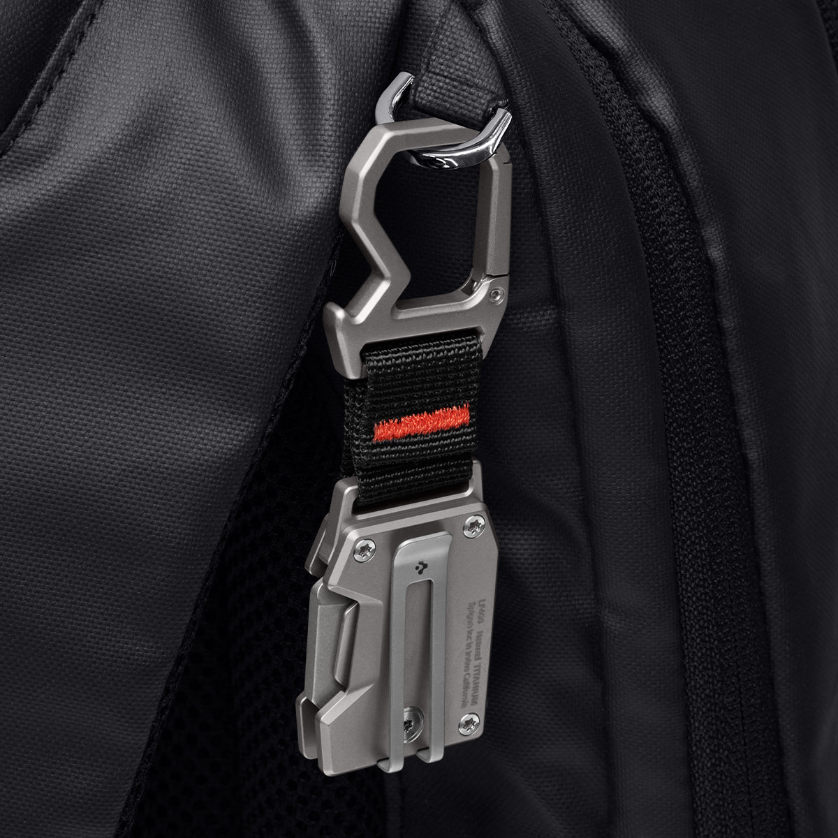 AHP06270 - Spigen Pocket Knife LF400 in Gunmetal showing the back clipped to a backpack