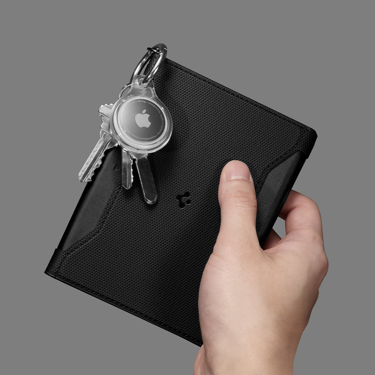 AFA05538 - Passport Holder in black showing the front with carabiner attached for airtag and keys