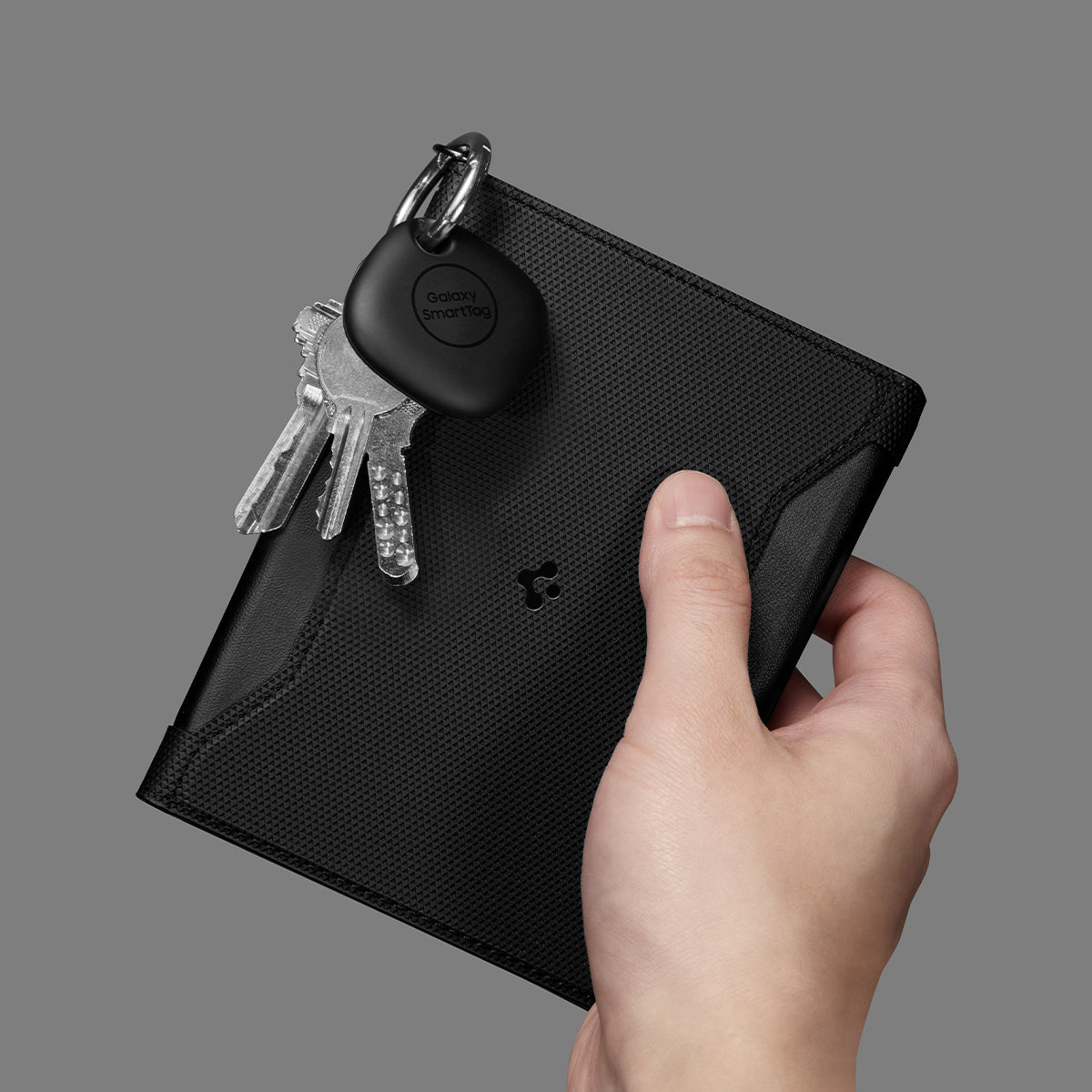 AFA05538 - Passport Holder in black showing the front with carabiner attached for keys