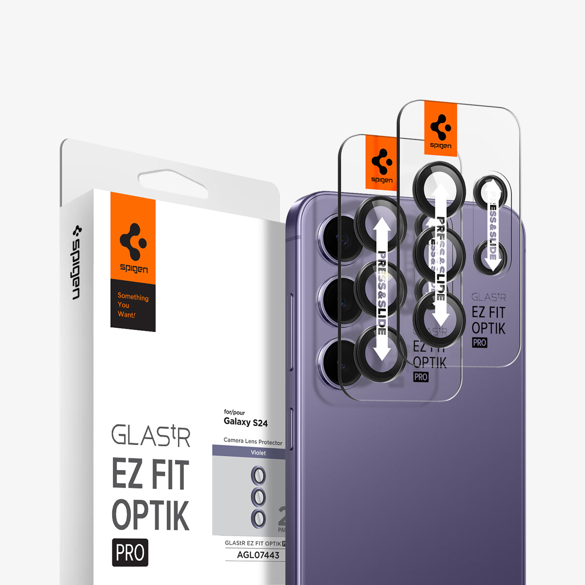 AGL07443 - Galaxy S24 Optik Pro EZ Fit Lens Protector in Violet showing the camera lens protector hovering above another lens protector tray and device showing back, behind it, is the packaging